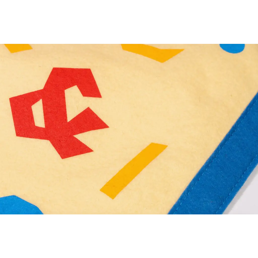 Red geometric shape with blue and yellow accents in Kelle Hampton inspired pendant light