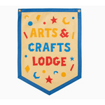 Shield-shaped banner with ARTS & CRAFTS LODGE by Kelle Hampton, featuring stars and moons