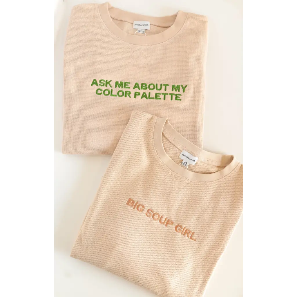 Two stylish beige waffle pullovers featuring fun sayings about color palette vibes