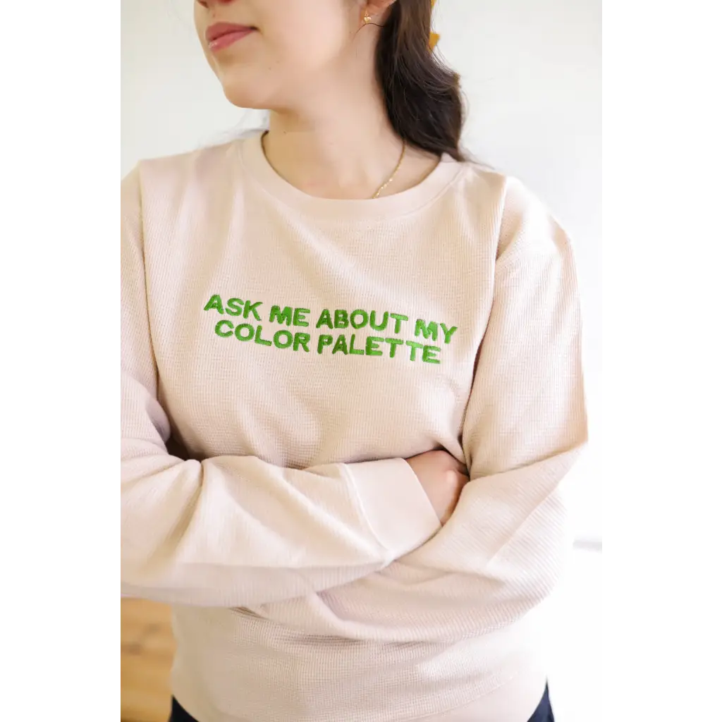 Beige waffle pullover featuring neon green text about color palette vibes