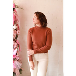 Stylish Ava Mock-Neck Sweater: brown turtleneck with ribbed cuffs, white pants for moms