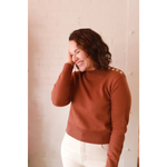 Stylish Ava Mock-Neck Sweater in rust ribbed knit with shoulder buttons