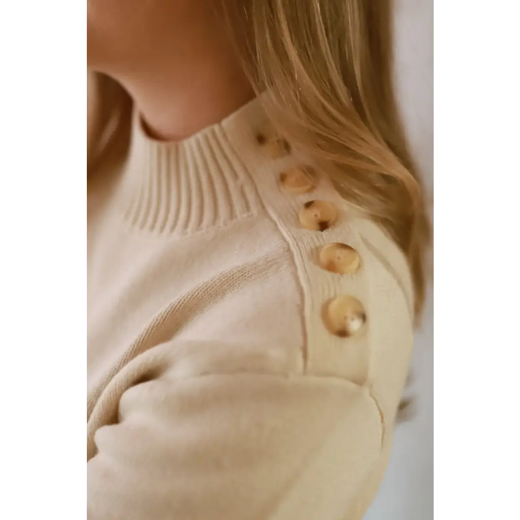 Ava Mock-Neck Sweater in beige with wooden buttons and ribbed knit