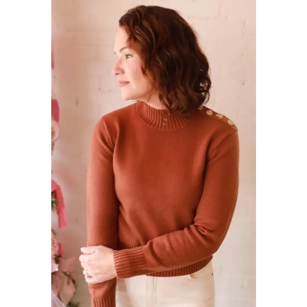 Stylish Ava Mock-Neck Sweater in rust ribbed knit with high neck and shoulder buttons