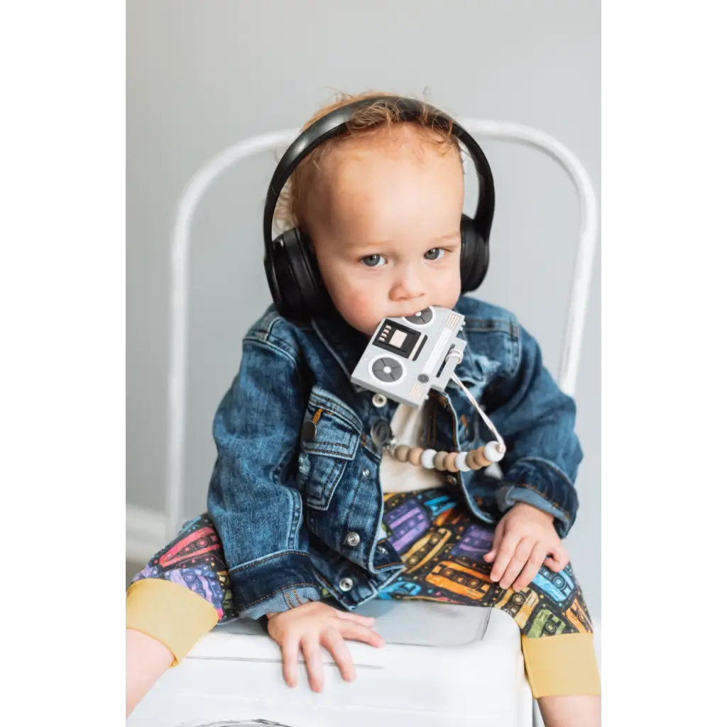 Toddler in denim rocking boom box silicone teether with headphones and cassette player