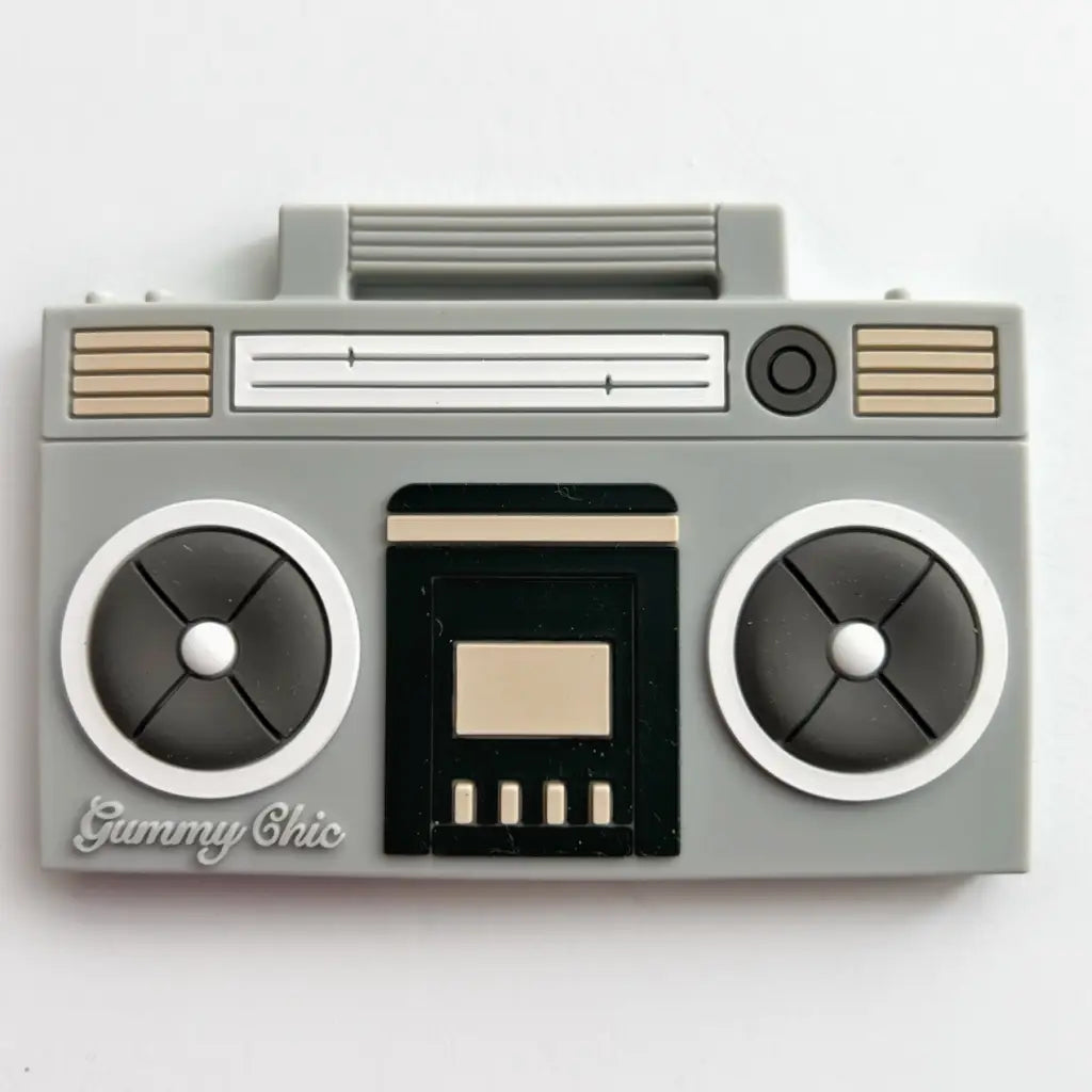 Retro Boom Box Silicone Teether featuring a grey boombox with tan accents and dual speakers