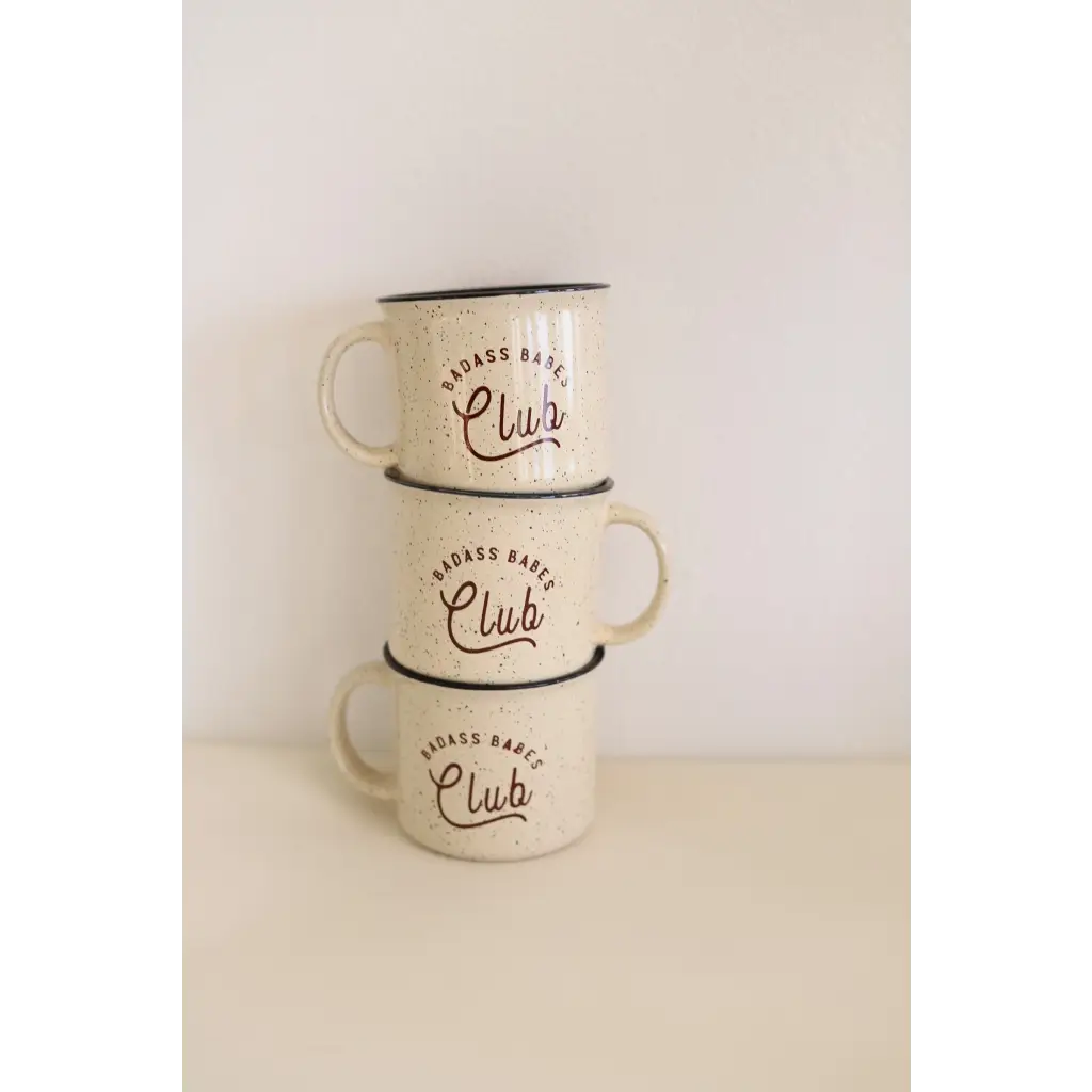 Three stacked white enamel campfire mugs with Club text for badass babes lovers