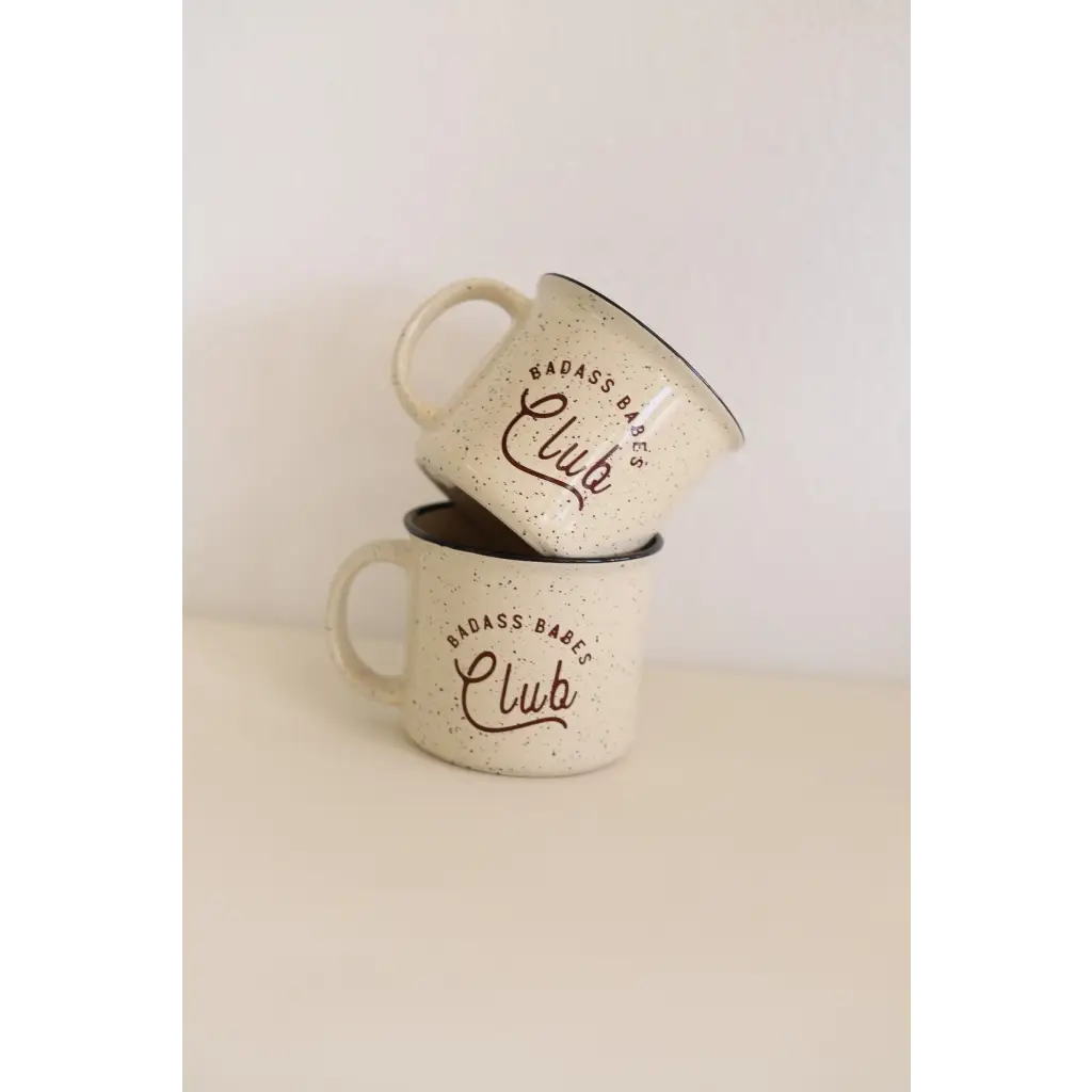 Two stacked speckled Campfire Mugs with Club text from Badass Babes 13oz set