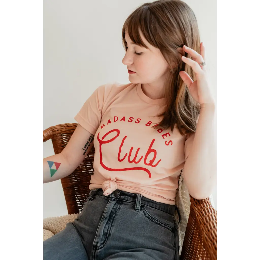 Peach Badass Babes Club Graphic Tee with bold red lettering for fierce style