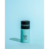 Sleek mint green Basil Mint Organic Lip Balm tube with black cap