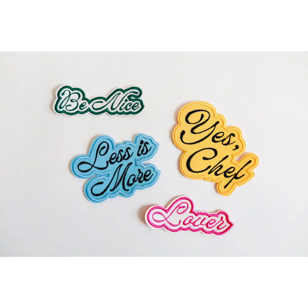 Colorful decorative text patches featuring phrases like Be Nice and Love for a nice iron-on patch