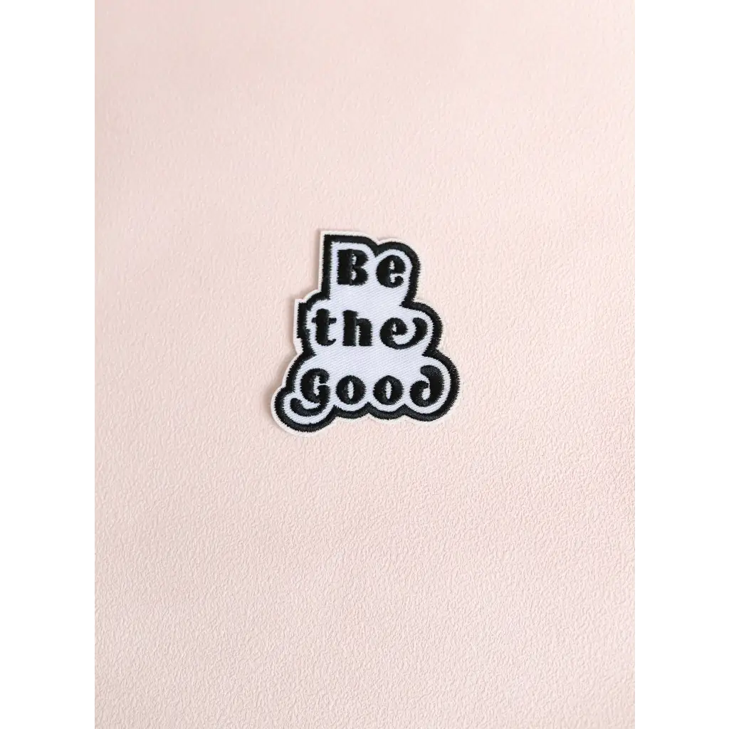 Black and white Be the Good iron-on patch for positive vibes and uplifting style