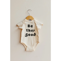 White baby onesie with Be the Good text, perfect organic cotton baby bodysuit
