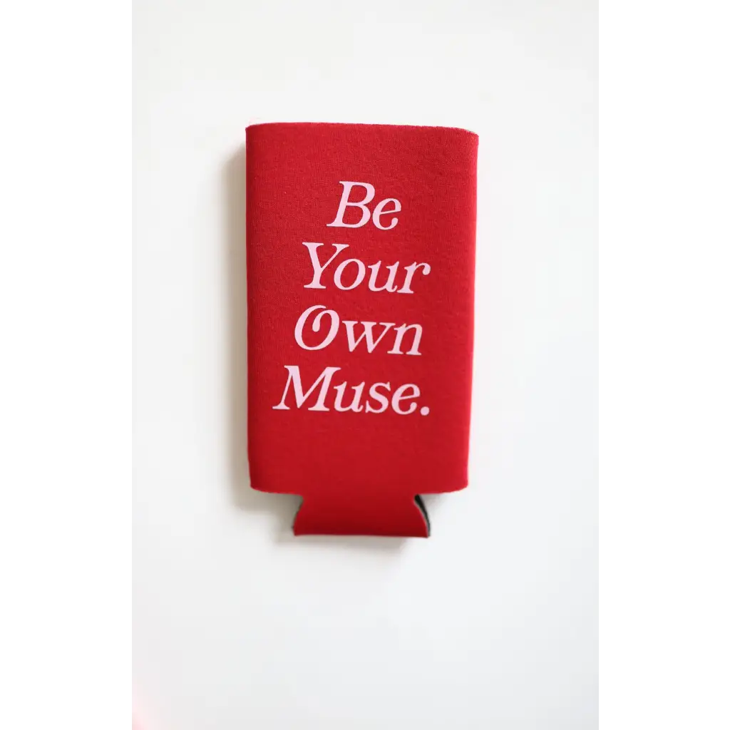 Red printed seltzer koozie saying Be Your Own Muse in white lettering