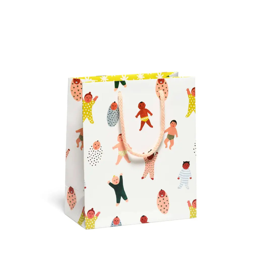 White gift bag with colorful baby design and handle, perfect for stylish womens clothes