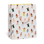 White gift bag with colorful baby illustrations and handles from Beautiful Baby gift bags featuring polished prints