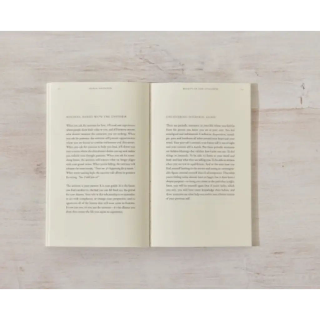 Open book with printed text showcasing polished prints in Beauty in the Stillness