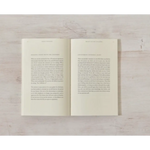 Open book with printed text showcasing polished prints in Beauty in the Stillness