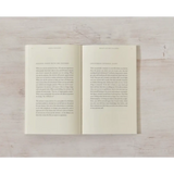 Open book with printed text showcasing polished prints in Beauty in the Stillness