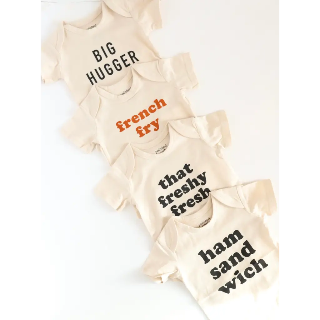 Four cream-colored t-shirts with fun food phrases from Big Hugger Organic Cotton set