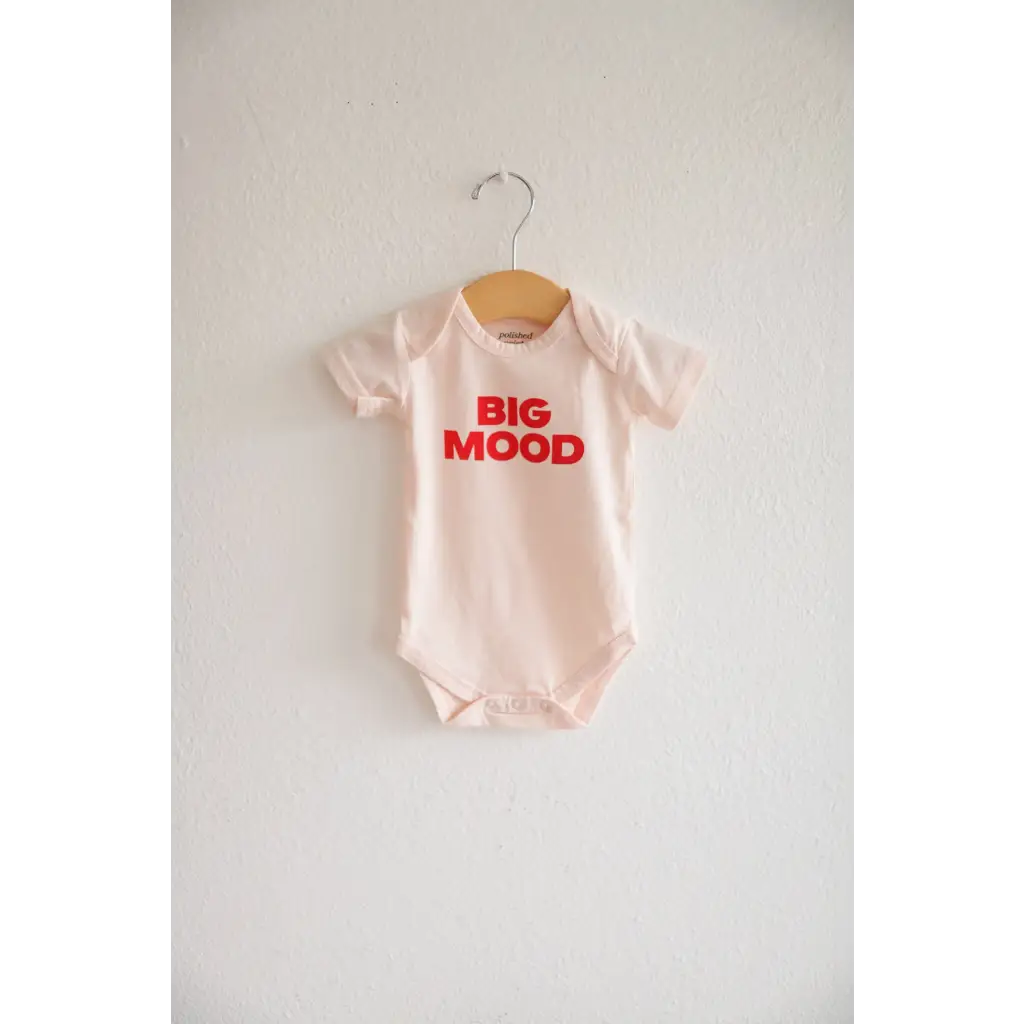 Light pink baby onesie with red BIG MOOD print made from organic cotton