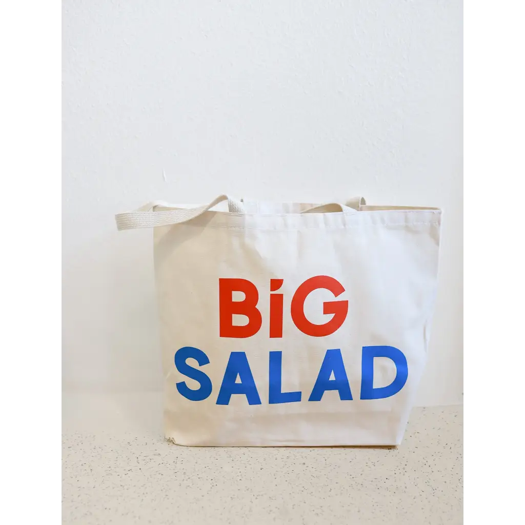 Canvas tote bag featuring bold Big Salad text in red and blue for stylish adventures