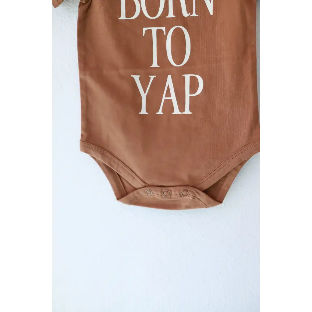 Brown organic cotton baby bodysuit from Born to Yap, super comfy for your little one