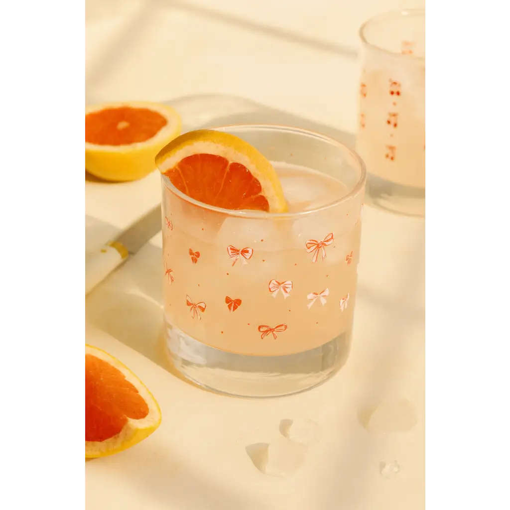 Pink grapefruit juice in Bow Cocktail Glass Set with peace signs camp vibe and pink bow design