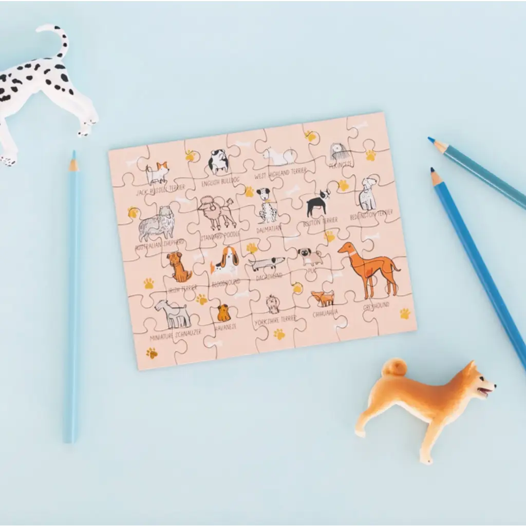 Whimsical dog illustrations on the Bow Wow Breeds Mini Puzzle for dog lovers