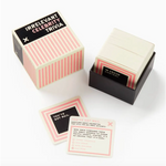 Pink and black striped trivia card box with matching cards for Irrelevant Celebrity Trivia