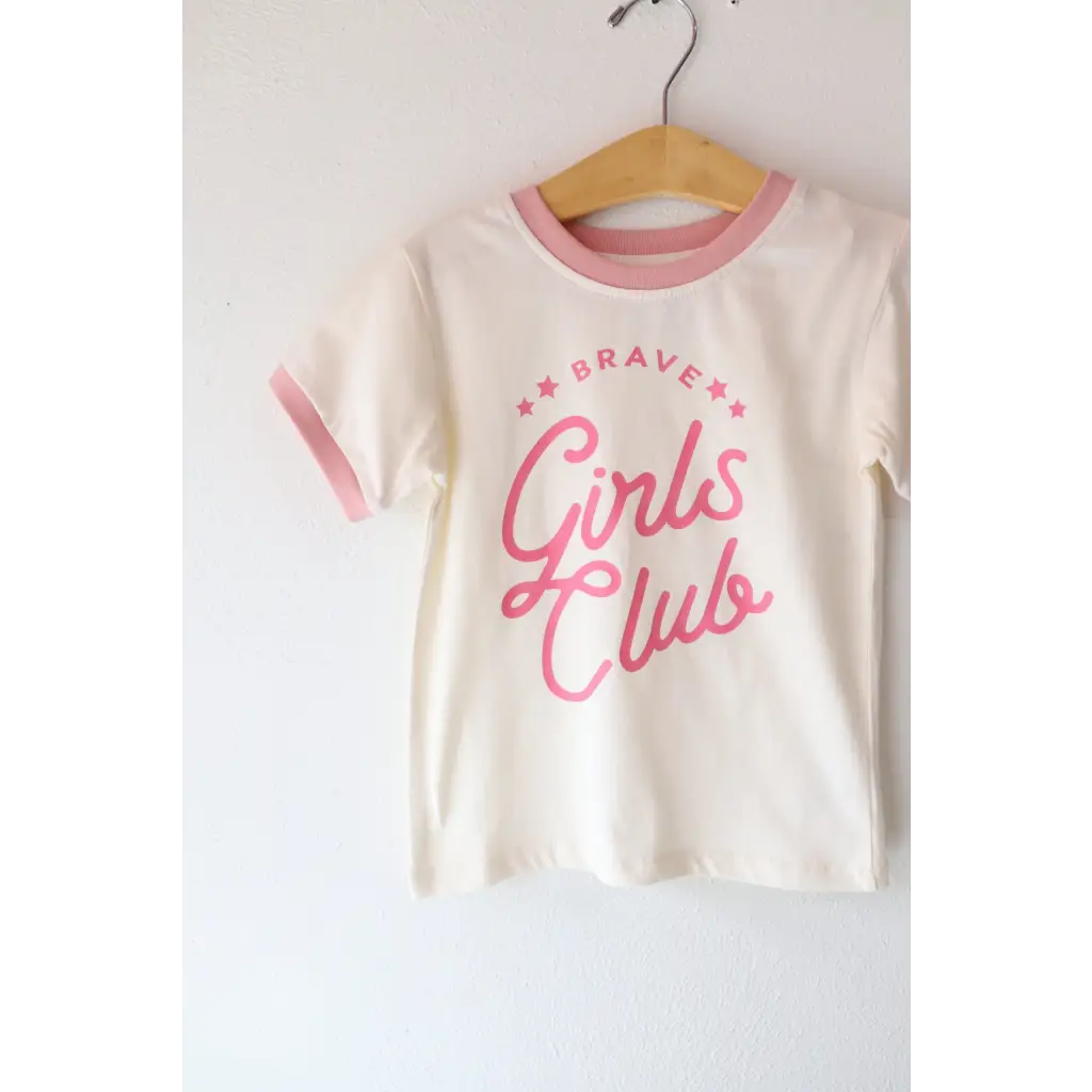 White t-shirt with pink trim and Brave Girls Club in pink lettering for brave girls