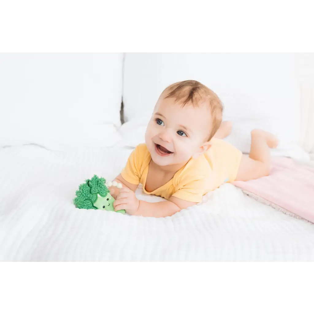 Green plush hedgehog teether toy for babies, soft textured broccoli crinkle design