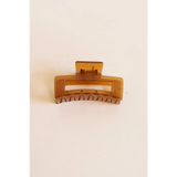 Brown medium size hair clip with rectangular design, your favorite go-to hair accessory