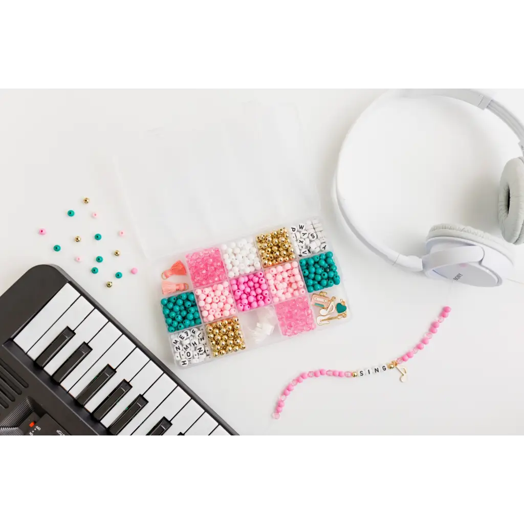 Electronic keyboard, colorful beads, and headphones for Bubblegum Groove DIY Bracelet Craft Kit