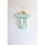 Mint green organic cotton baby onesie with bub text on a metal hanger for stylish babywear