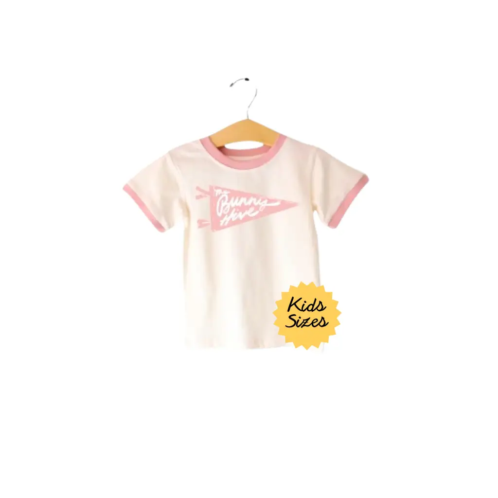 Cream-colored Bunny Hive Signature Ringer Tee for kids with cute pink trim