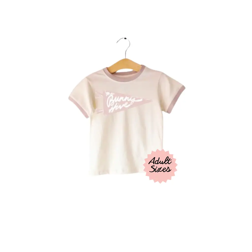 Cream-colored Bunny Hive Signature Ringer Tee with pink trim for a cute casual look