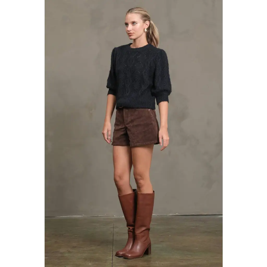Stylish knit sweater with brown leather knee-high boots