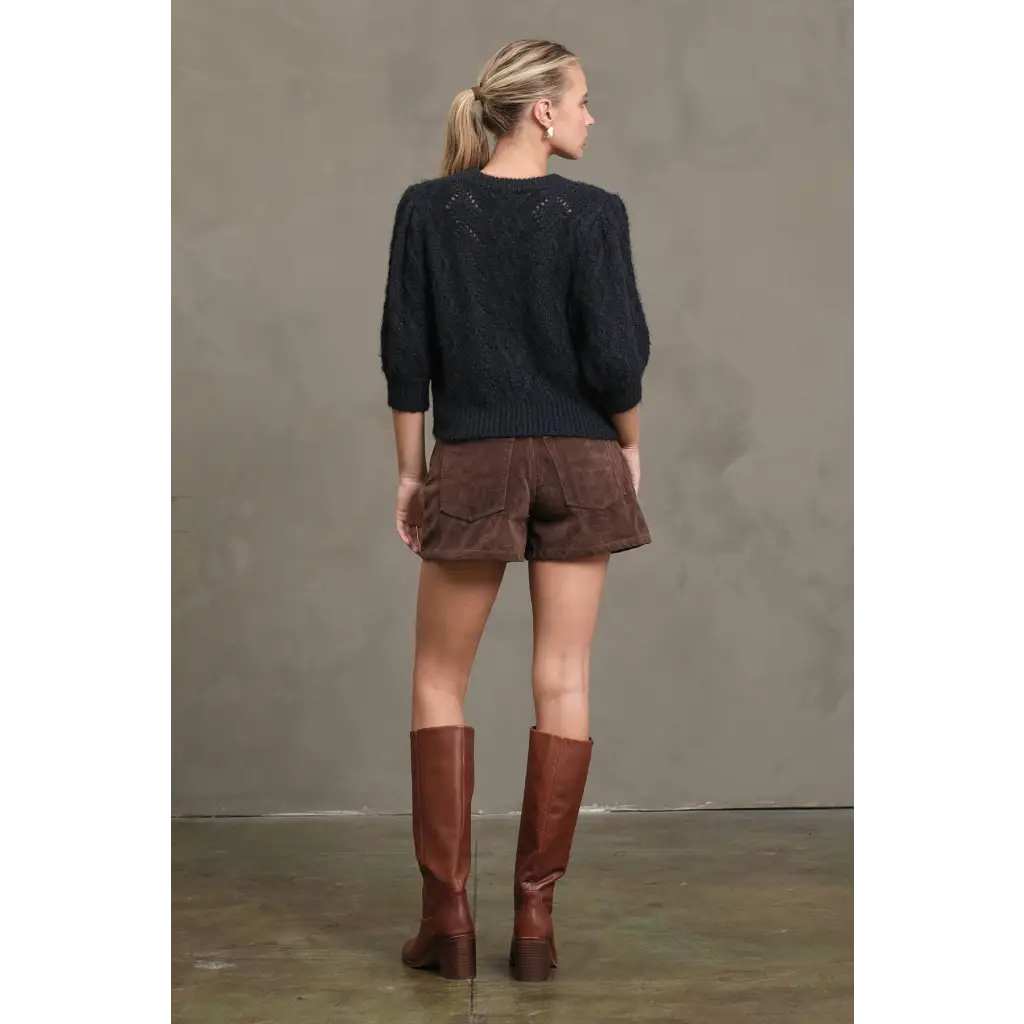 Dark navy knit sweater with puffed sleeves and textured back