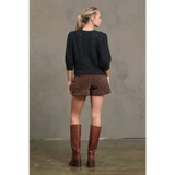 Dark navy knit sweater with puffed sleeves and textured back