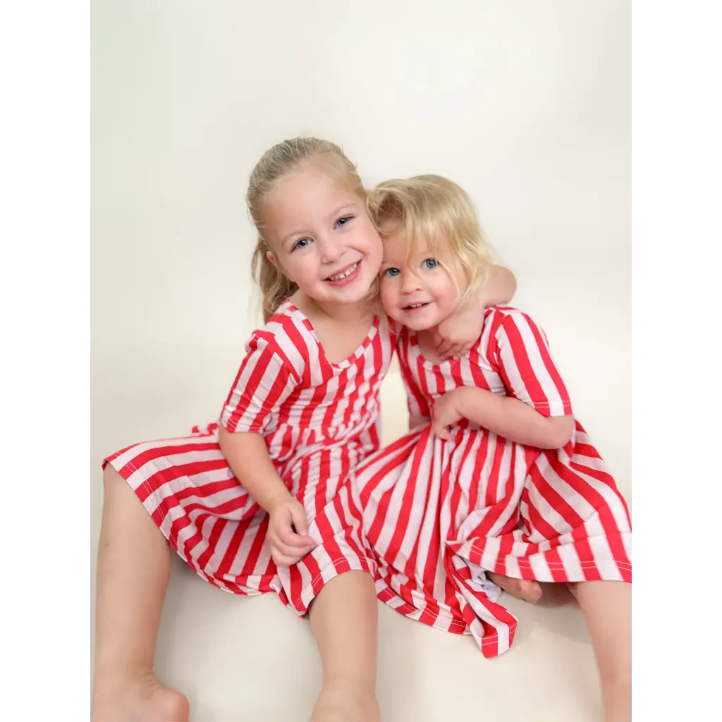 Red and white striped bamboo twirl dress for girls with ruffled hem