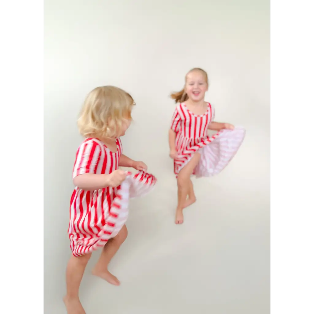 Red and white striped bamboo twirl dress for girls with ruffled skirt