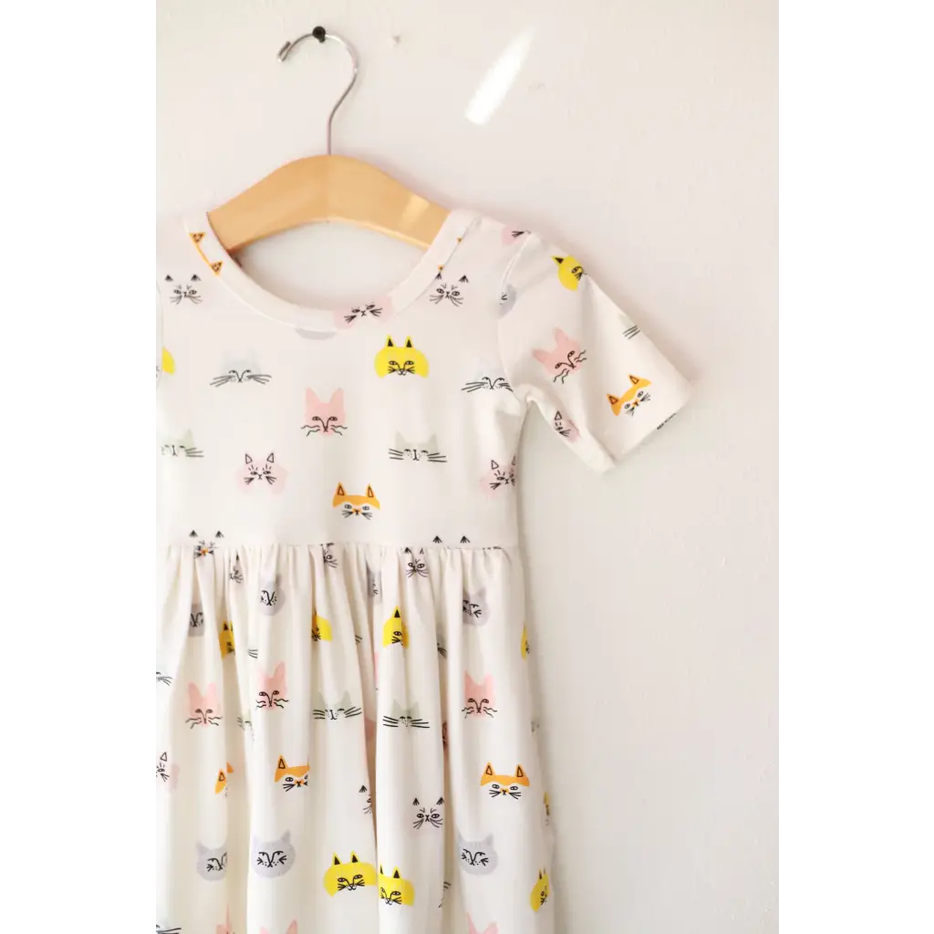 Cute Cat Lover Bamboo Twirl Dress featuring adorable cat faces on a white background