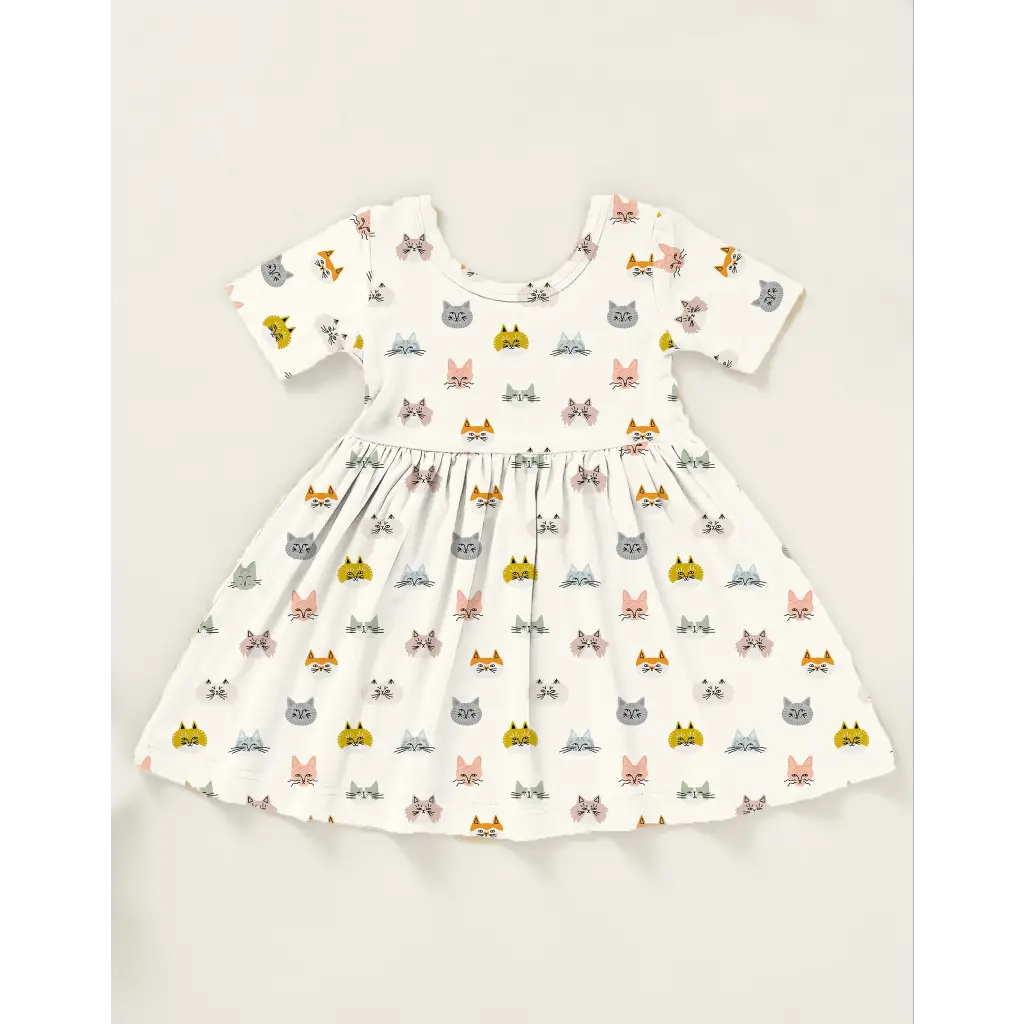 White Cat Lover Bamboo Twirl Dress with colorful cat faces all over it