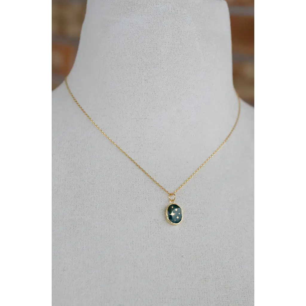 Delicate gold plated Celestial Gemstone Pendant Necklace with oval dark green gem