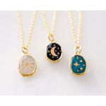 Gold plated celestial pendants: sun, moon stars, teal stars
