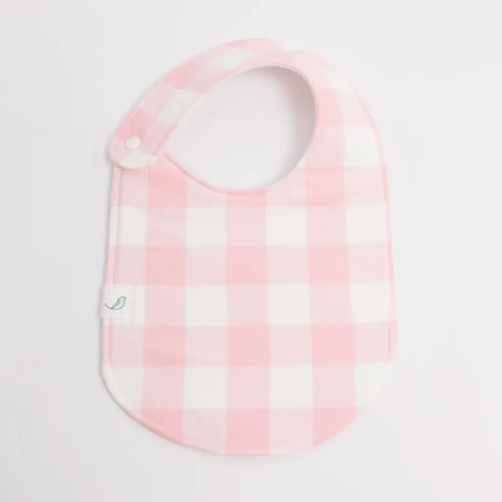 Pink and white gingham Charlie Snap Bib featuring adorable yellow ducks for babies