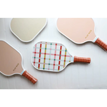 Colorful Pickleball paddles with wooden handles, featuring plaid and checkerboard designs