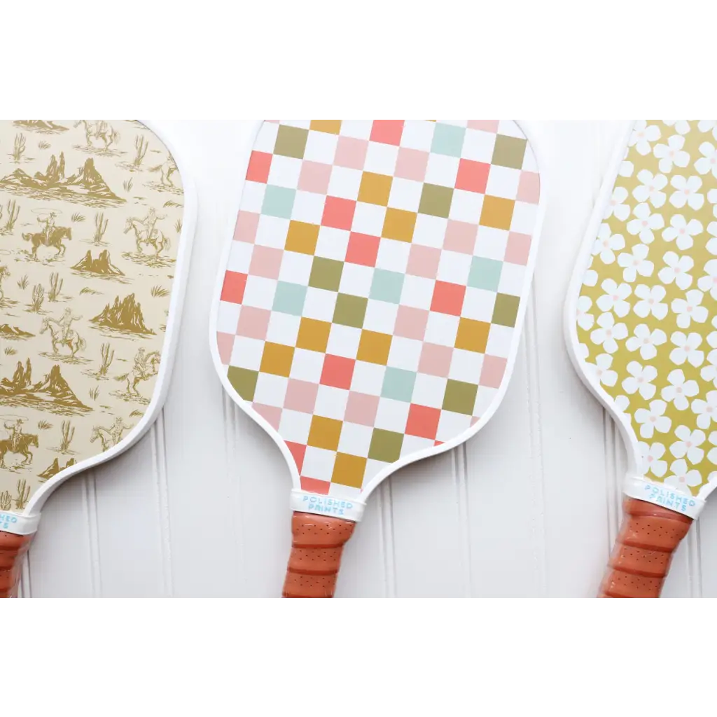 Decorative Play Nice White Pickle Ball Paddle with fun designs and stylish brown handle