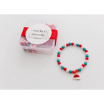 Beaded bracelet with red and turquoise beads and cake charm for a perfect Christmas stocking